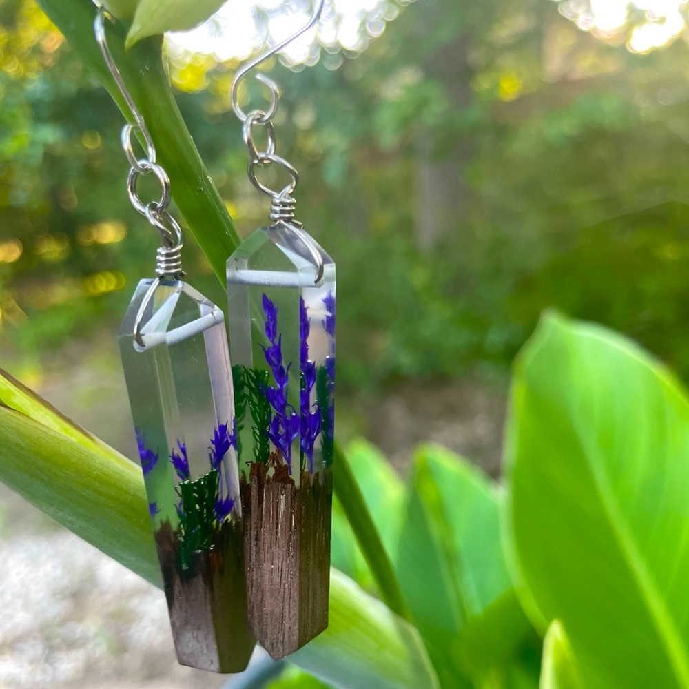 Pressed flower resin earrings and wood.